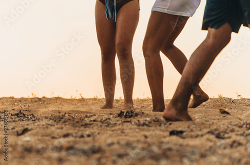 Soccer player with ball in action outdoors at the beach