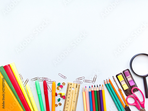 Wallpaper Mural Colorful  school suplies against light blue background with copy space. Back to school concept, top view. Torontodigital.ca