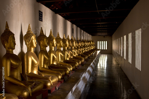 budha staues interior of a temple in Thailand photo