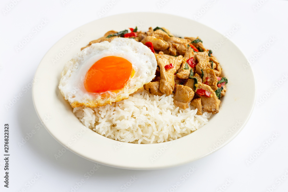 Rice topped with stir-fried chicken and holy basil, fried egg Rice topped with stir-fried chicken and holy basil, fried egg