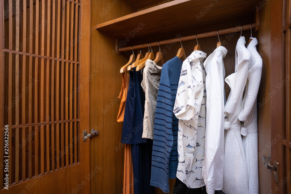 clothes hanger on the wood wardrobe clothes hanger on the wood wardrobe