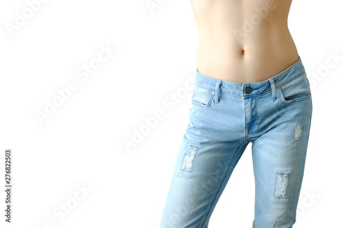 Fototapeta Naklejka Na Ścianę i Meble -  Body of a beautiful woman skin. She wears sexy fit jeans on white background .Beauty and fashion concepts.