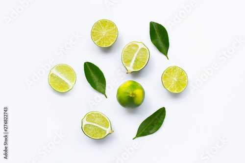 Fresh limes with leaves isolated on white