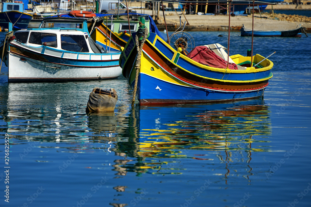 close up colorful traditional wooden fishing boats in harbor of Mediterranean island Malta