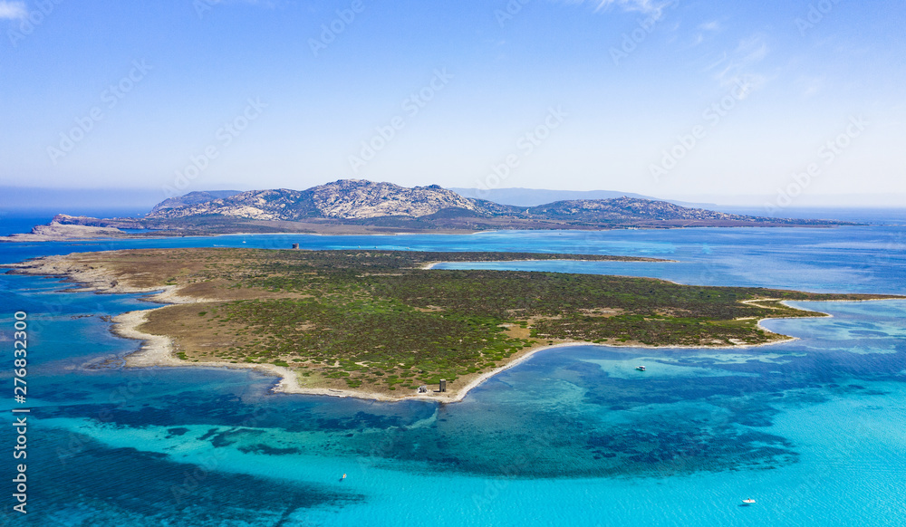 View from above, stunning aerial view of the Isola Piana island and the Asinara island bathed by a beautiful turquoise clear water. Stintino, Sardinia, Italy.