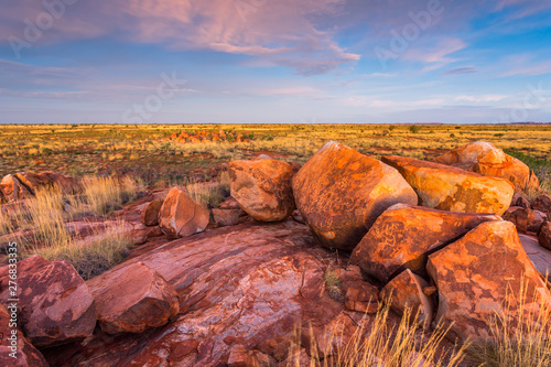 Ancient aboriginal rock drawings (aboriginal art/hieroglyphics) carvings on granite boulders in the north of Western Australia, Australia. Indigenous rock paintings.