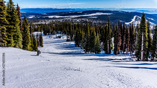 Spring skiing in the High Alpine on the Hills surrounding the Alpine Village of Sun Peaks in the Shuswap Highlands of central British Columbia, Canada © hpbfotos