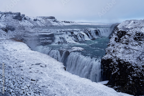 Gulfoss Waterfall in Iceland during snowfall in winter