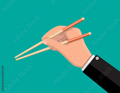 Kitchen asian chopsticks in hand. Bamboo wooden sticks for food. Vector illustration in flat style