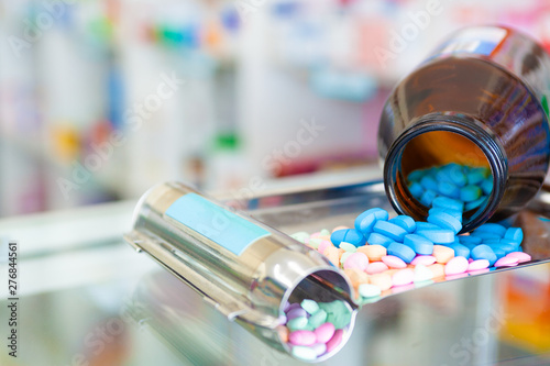 Brown medicine bottles and painkillers on the medicine tray