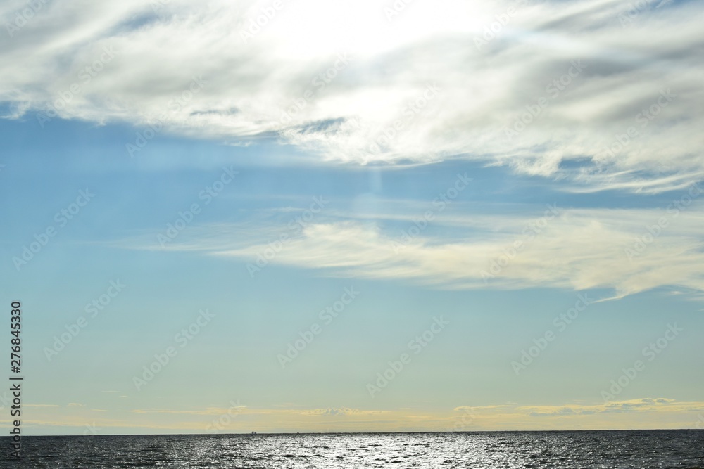 Naklejka premium clouds over the sea