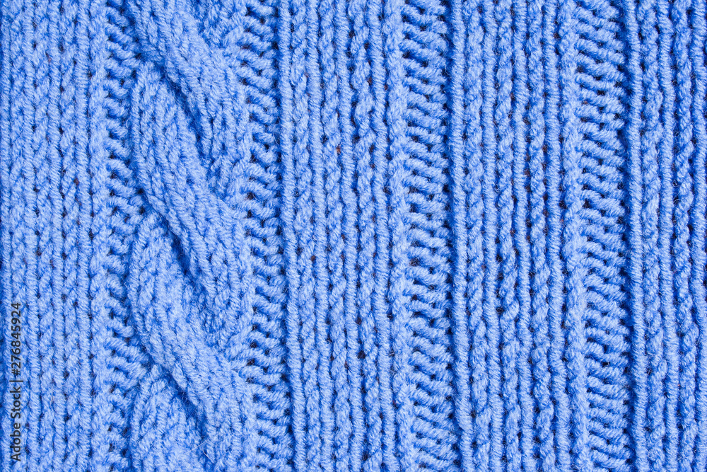 Knitted lilac yarn pattern, pigtail pattern and bollards Knitted lilac yarn pattern, pigtail pattern and bollards
