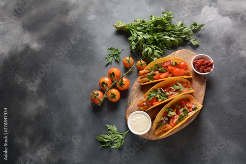 Tacos with grilled chicken and vegetables - Mexican food style photo