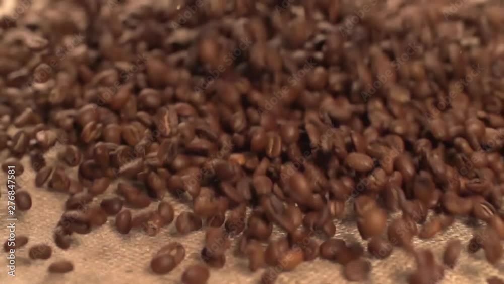Coffee beans falling pouring Slow Motion Coffee beans falling pouring Slow Motion