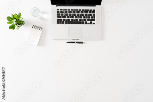 Overhead shot of business desktop with laptop
