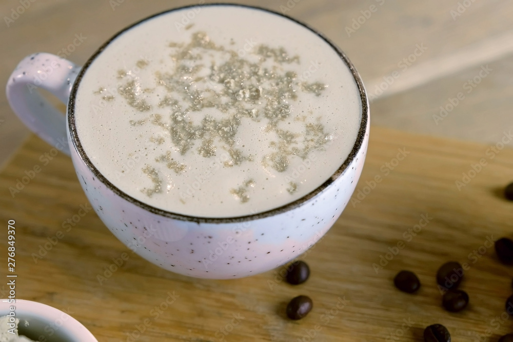 Cup of coffee with halva served on a tray with honey and coffee beans Cup of coffee with halva served on a tray with honey and coffee beans