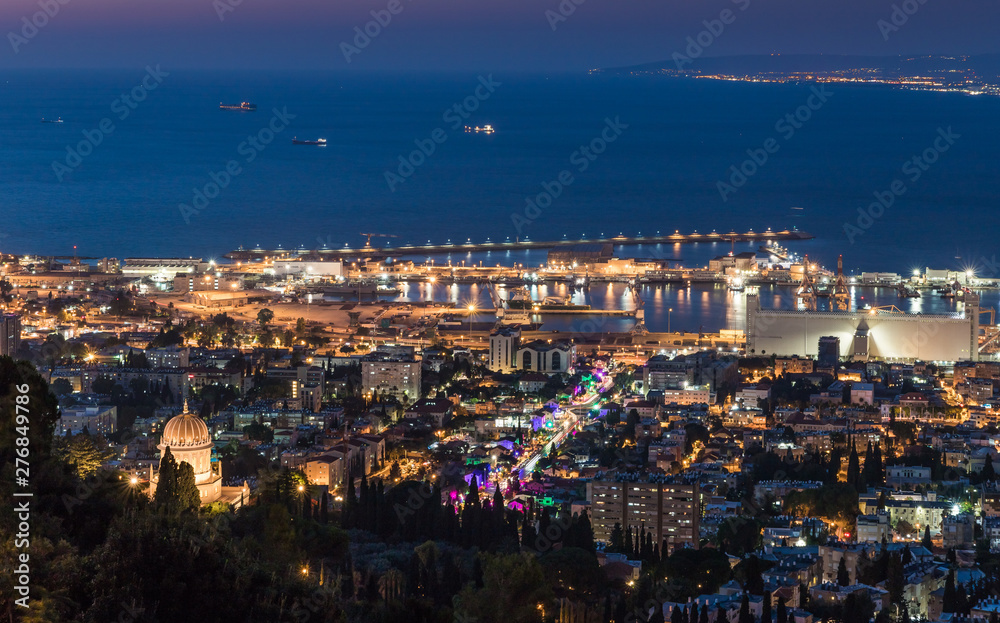 Panoramic view of downtown Haifa, Haifa harbor and bay at night. View from Mount Carmel