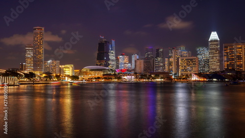 Skyline panorama of Singapore Downtown at night with Esplande and business buildings with offices. Views from Marina Bay. © videobuzzing