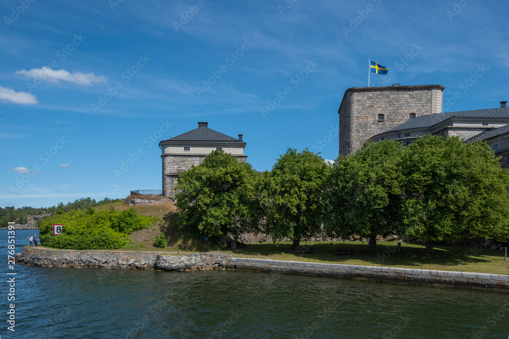 The pier and fortress at the town Vaxholm in Stockholm archhipelago a summer day