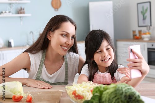 Mother with cute daughter t...