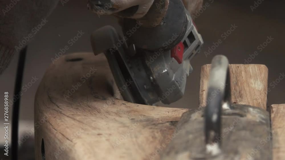 Wood working detail with a disk grinder. Close up and slow motion. Wood working detail with a disk grinder. Close up and slow motion.