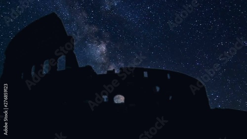 Colosseum silhouette with time lapse stars