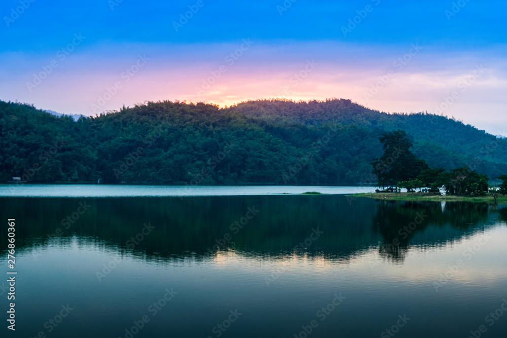 Fototapeta premium Vacation Outdoors Concept, Twilight Sunrise and Mountains, Sea and Sky Background