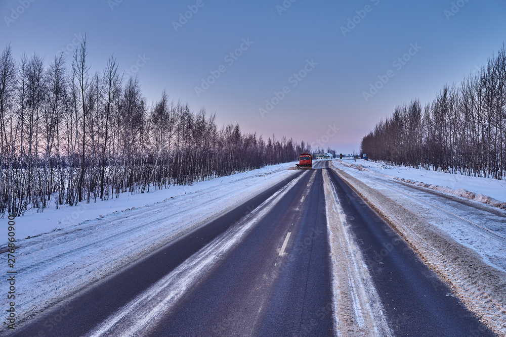 snow plow on a country road