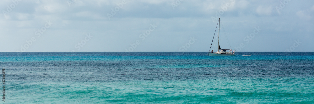 Yacht in blue ocean, panorama