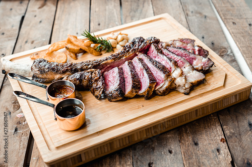 Tableau sur toile Grilled Australian Tomahawk on Wood Plate