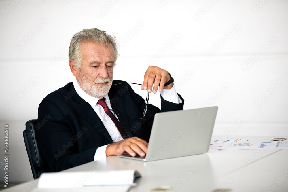 businessmen using notebook and fill serious about the work done until the headache businessmen using notebook and fill serious about the work done until the headache