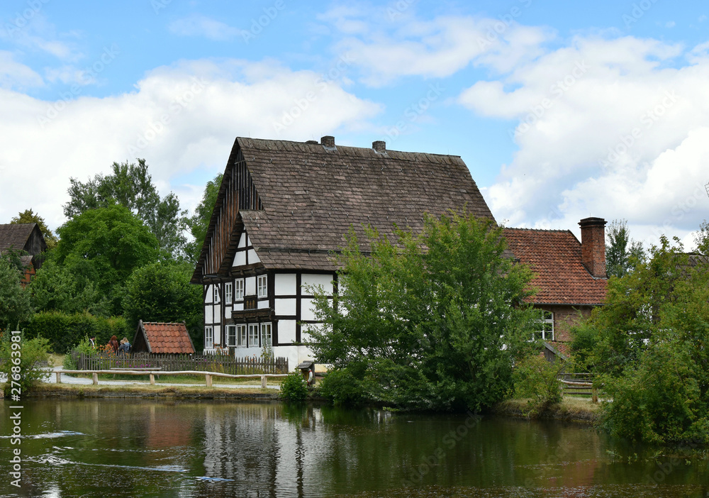 Country landscape. An old house on the bank of a quiet river. Country landscape. An old house on the bank of a quiet river.