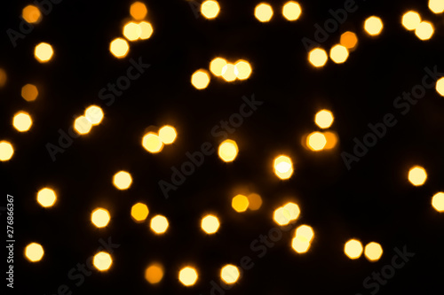 Abstract festive background with scattered lights. Holiday concept