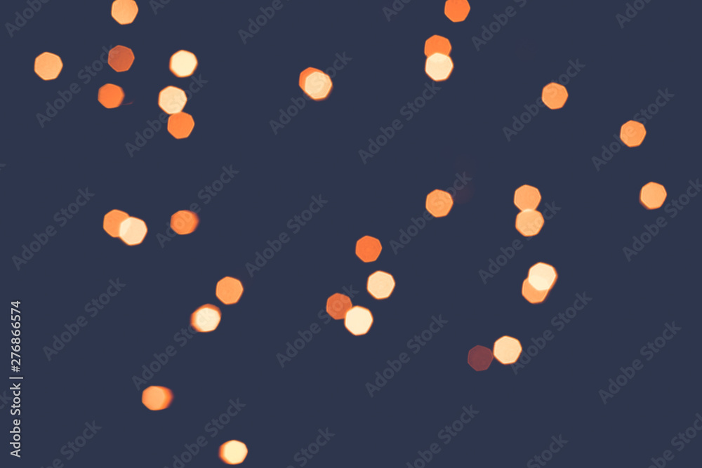 Abstract scattering of golden lights on a dark background. Tinted Abstract scattering of golden lights on a dark background. Tinted