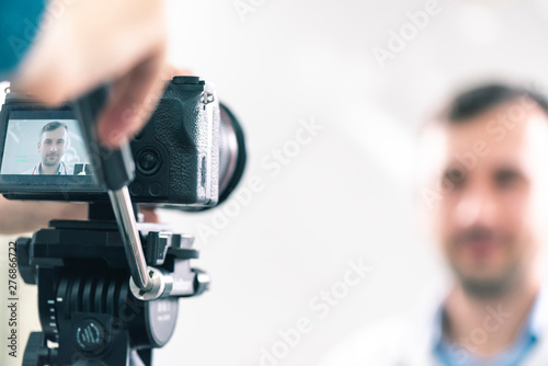 Caucasian male dentist posing in front of the camera