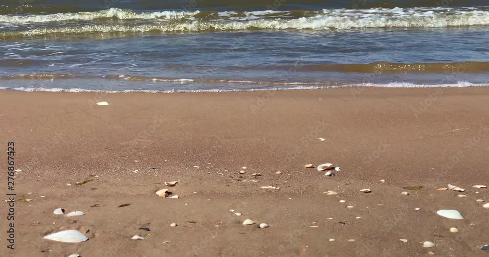 Soft sea waves splashing on sandy beach, 4K. Soft sea waves splashing on sandy beach, 4K.