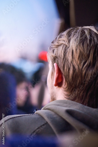 Young blonde adult looking at the sunset