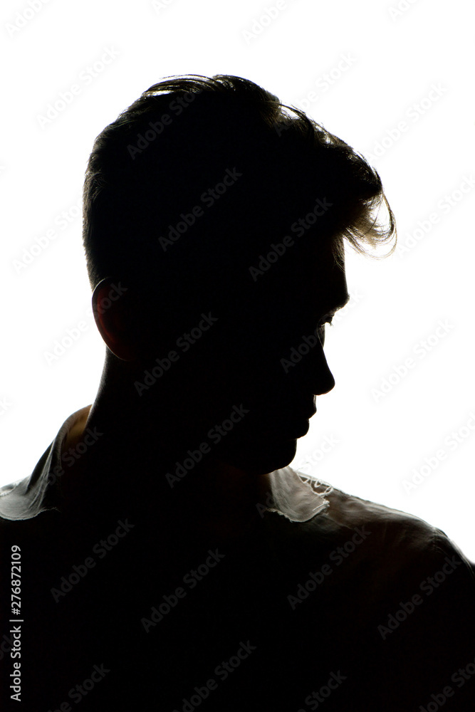 Silhouette of a young man isolated on white