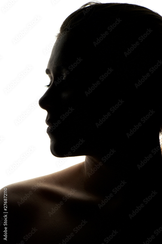 Silhouette of a young woman isolated on white