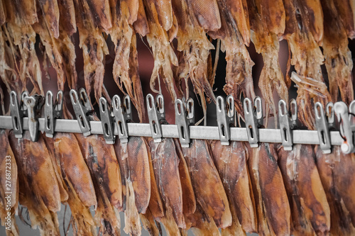 dried squids hang on the rack, Thai beach