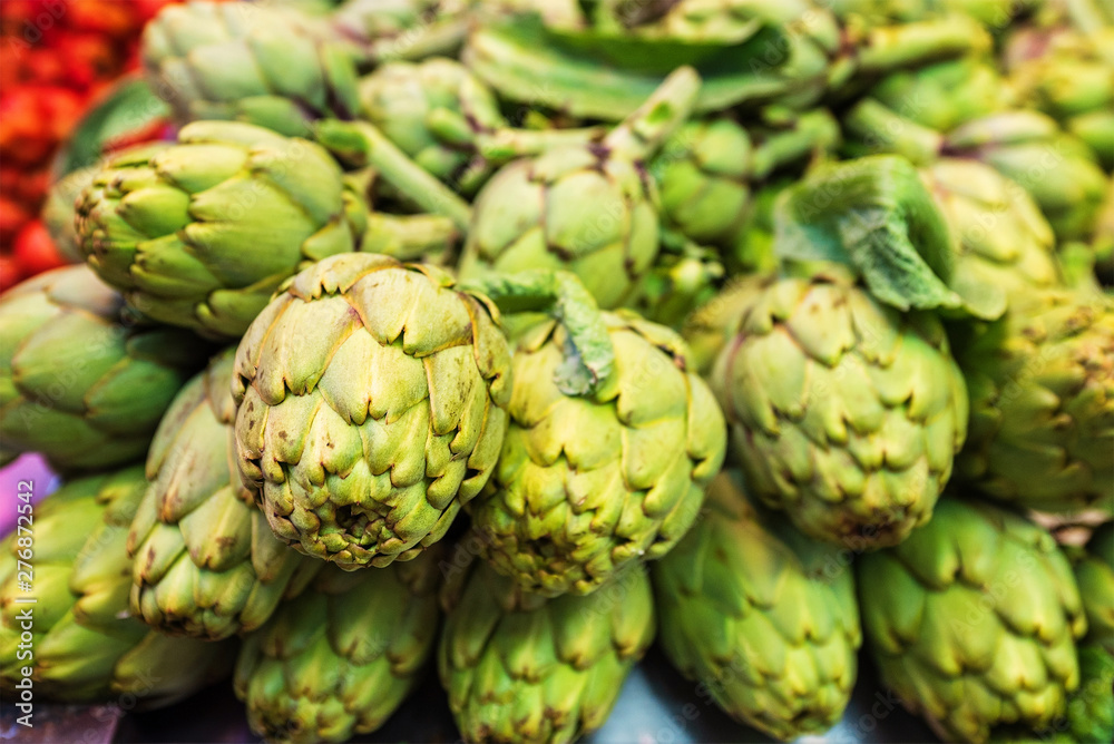 Green artichoke for sale at the local marketplace Green artichoke for sale at the local marketplace