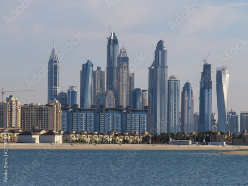 View of the artificial island of Palm Jumeirah and the skyscrapers of Dubai from the beach of Aquaventure water park 