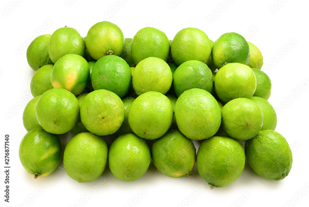 Many fresh limes on white background. Many fresh limes on white background.