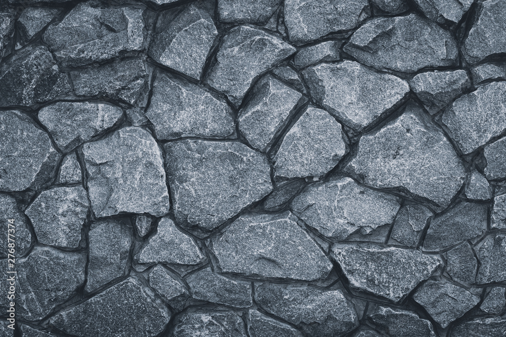 Fototapeta premium Gray stone wall texture. Grey rock pattern. Grunge rocky road. Granite textured, urban architecture. Surface of masonry background.