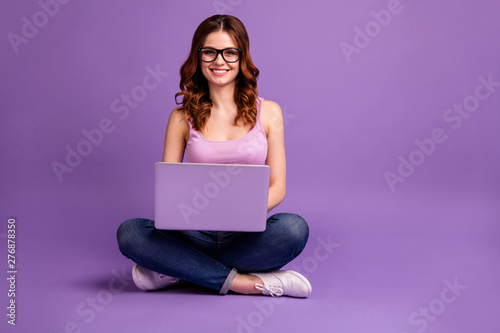Portrait of attractive teen teenager have modern technology feel content glad satisfied wear singlet denim youth hipster purple colorful bright background isolated