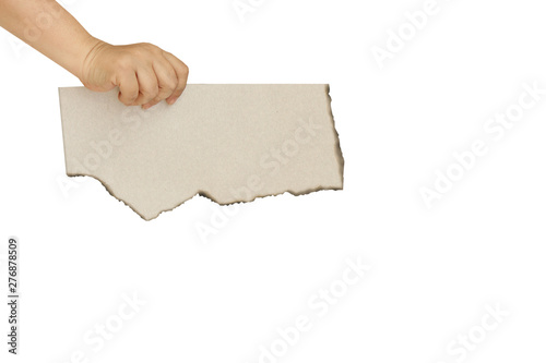 female hand holding a piece of torn paper with torn edges on a white background, isolate, copy space