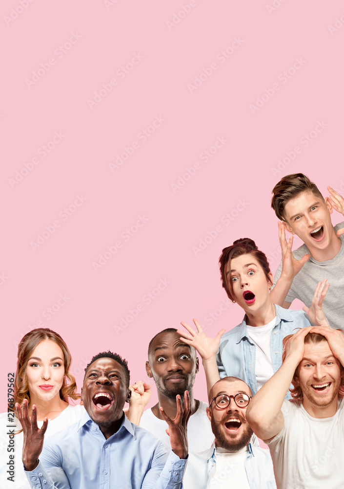 Fototapeta premium Collage of close up portraits of 7 young people on coral pink background. The human emotions, facial expression concept. Celebrating, wondering, feeling like a winners, astonished and shocked.