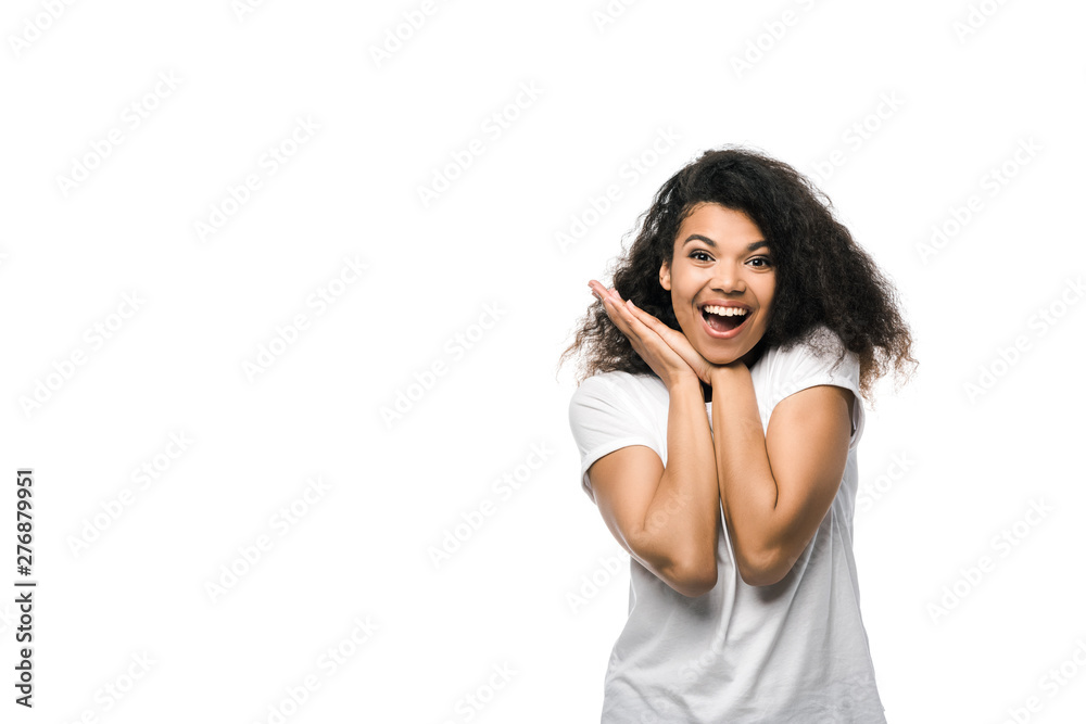 positive african american girl in white t-shirt standing isolated on white positive african american girl in white t-shirt standing isolated on white
