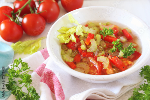 Summer vitamin detox soup with celery, red bell pepper and tomatoes