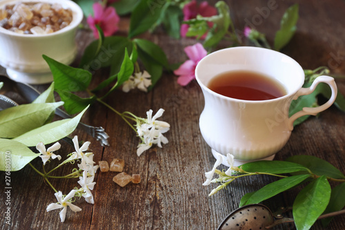 Decorative composition of vintage style: romantic tea drinking with jasmine tea